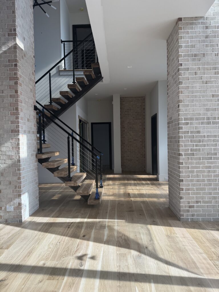 hardwood floors installed by staircase in Charlotte