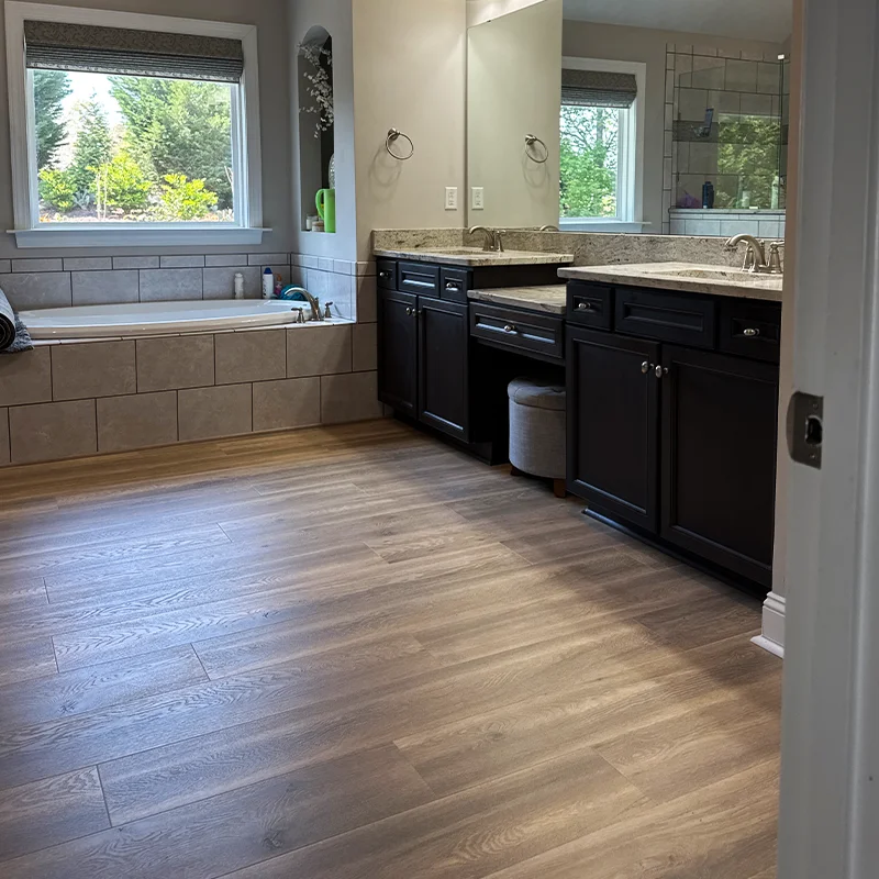 LVP flooring installed in bathroom Charlotte Fabricio Hardwood Floors